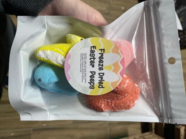 A bag of colored easter eggs with a sticker on it.