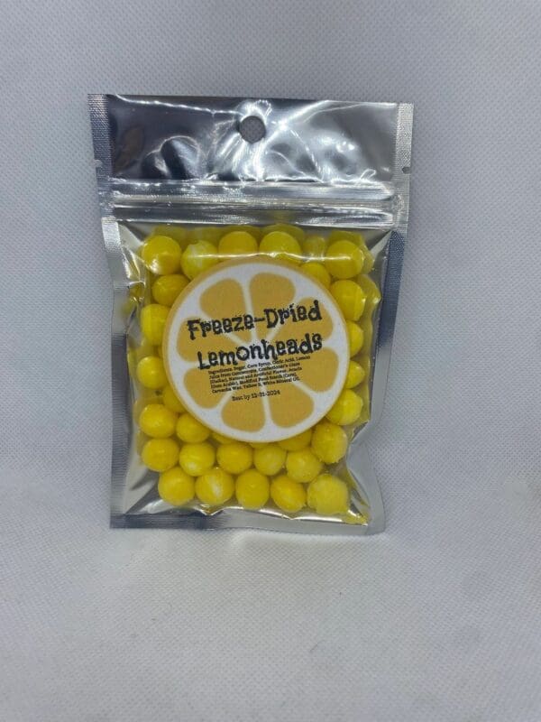 A bag of yellow candy covered in white chocolate.