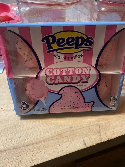 A box of cotton candy with pink and white stripes.